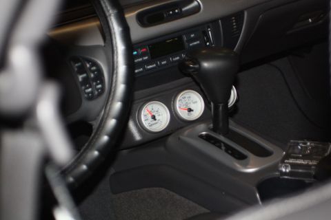 2003 Mercury Marauder - Aftermarket gauges are visible in the interior of this vehicle, next to the automatic transmission shifter.