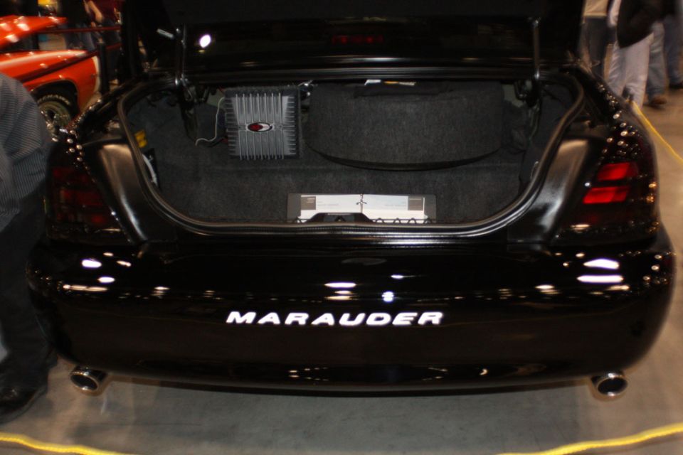 Black 2003 Mercury Marauder rear with trunk open showing amplifiers
