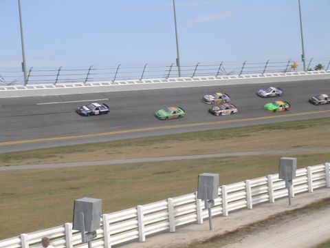 1993 Ford C-350 (Centurion Conversions) - Multiple race cars compete on a sunny day at Daytona International Speedway.