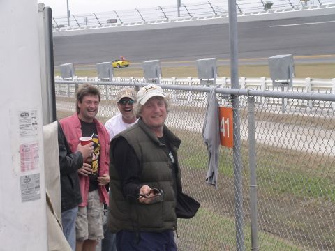 1993 Ford C-350 (Centurion Conversions) - Spectators gather at a race track, with a yellow sports car visible on the course.