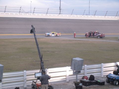 1993 Ford C-350 (Centurion Conversions) - Race cars and support vehicles are present on the Daytona 500 track.