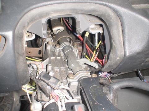 1993 Ford C-350 (Centurion Conversions) - The steering column's internal wiring is visible, with many colorful wires exposed.