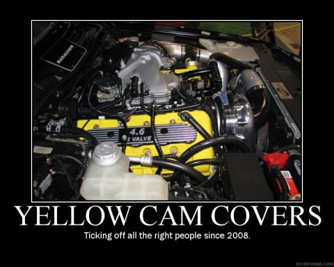 2003 Mercury Marauder - The engine bay features bright yellow cam covers and a "Marauder" label, suggesting a specific vehicle model.
