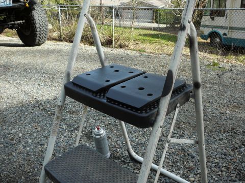 1991 Ford Bronco - A step ladder sits on gravel with a spray can nearby.