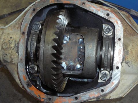 1991 Ford Bronco - Close-up of an open differential housing with visible gears and welding on the case.