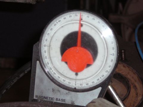 1991 Ford Bronco - Close-up of an inclinometer gauge with a magnetic base, used for measuring angles.