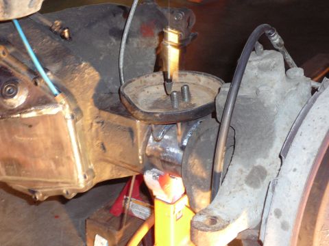 1991 Ford Bronco - Detail of a vehicle's suspension system, showing a part that has been welded.