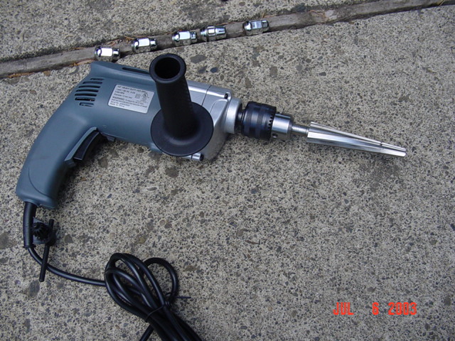 Drill setup with the tapered reamer