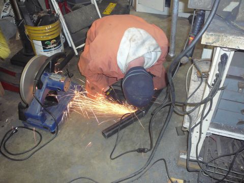 1991 Ford Bronco - Metalworking in progress with a chop saw and sparks.