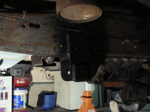 1991 Ford Bronco - Custom suspension brackets are welded to the vehicle's frame, indicating aftermarket modifications.