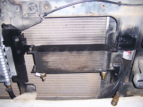 1991 Ford Bronco - An aftermarket transmission cooler is visible, mounted in front of the primary radiator assembly.