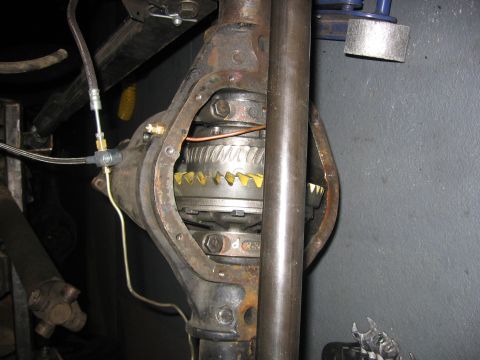 1989 Ford Bronco - The internal gears of a vehicle's differential are visible after the cover has been removed.