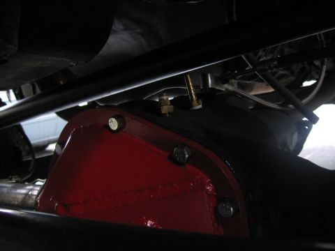 1989 Ford Bronco - Close-up view of a vehicle's rear differential, painted red.
