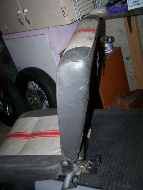 1988 Suzuki Samurai - A car seat with a distinctive red and white striped pattern is shown.
