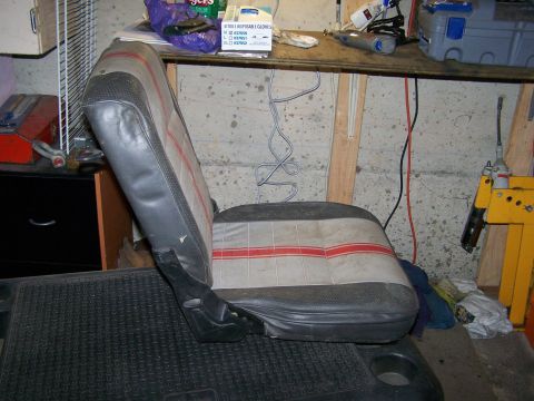 1988 Suzuki Samurai - A single car seat is shown in what appears to be a workshop or garage setting.