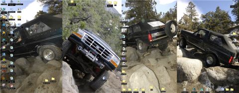 1995 Ford Bronco - This black Ford Bronco navigates a challenging rocky terrain, its off-road capabilities.