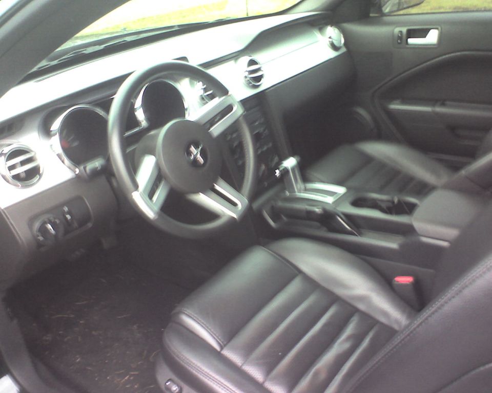 Black leather interior of a fifth-generation Ford Mustang