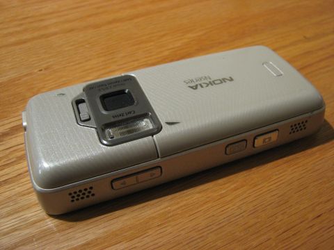 2003 Ford Crown Victoria - Nokia Nseries cell phone with Carl Zeiss camera lens is shown on a wooden table.