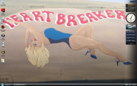 1988 Ford Bronco - A digital desktop background displays nose art of a woman and the words 'HEART BREAKER'.