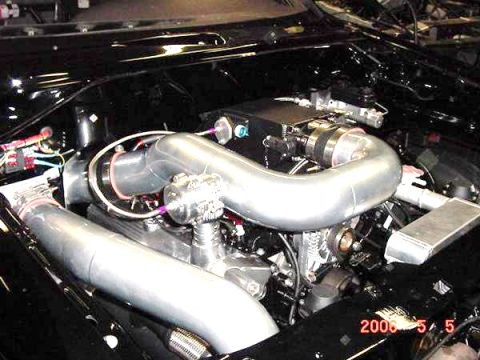 2007 Ford Mustang - Custom engine bay modifications visible, including turbocharger and intercooler piping. Date stamp indicates 2005.