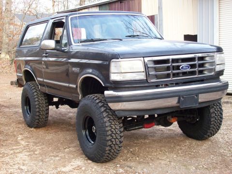 1992 Ford Bronco - This lifted 1992 Ford Bronco has large off-road tires and a chrome grille.