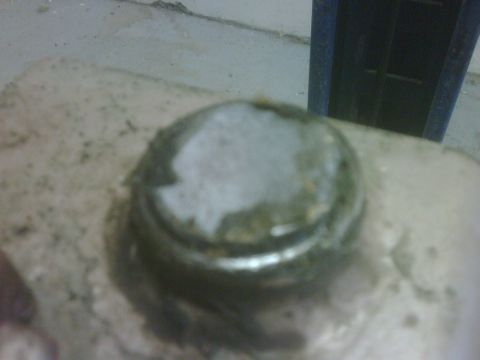 1996 Ford Bronco - A dirty hubcap is shown in this close-up photo.