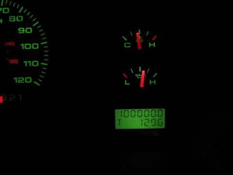 2004 Ford F-150 - The dashboard displays the odometer reading of 100,000 miles and a temperature of 129.6 degrees.