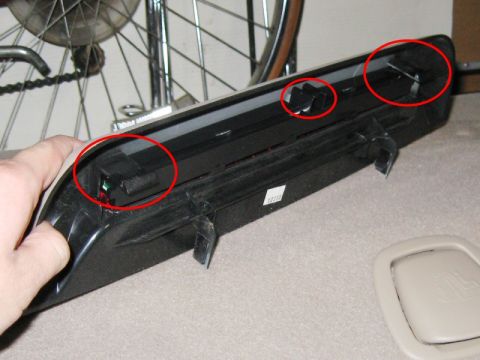 2003 Ford Taurus - Use a slim screwdriver or the panel removal tool to pop the two tabs under the third brake light to release it from the panel. Also disconn…