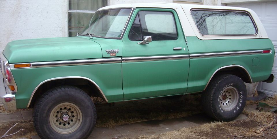 Green and white late-1970s Ford full-size Bronco side profile