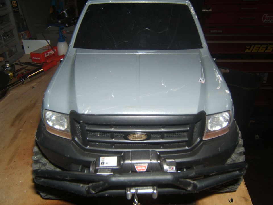 RC truck front end with winch and Ford logo on grille