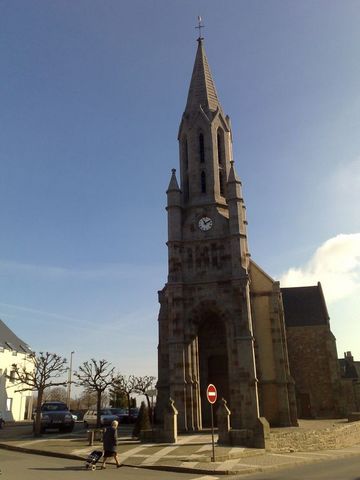 1991 Ford LTD Crown Victoria - Photograph of a stone church with a clock tower, not a technical document.