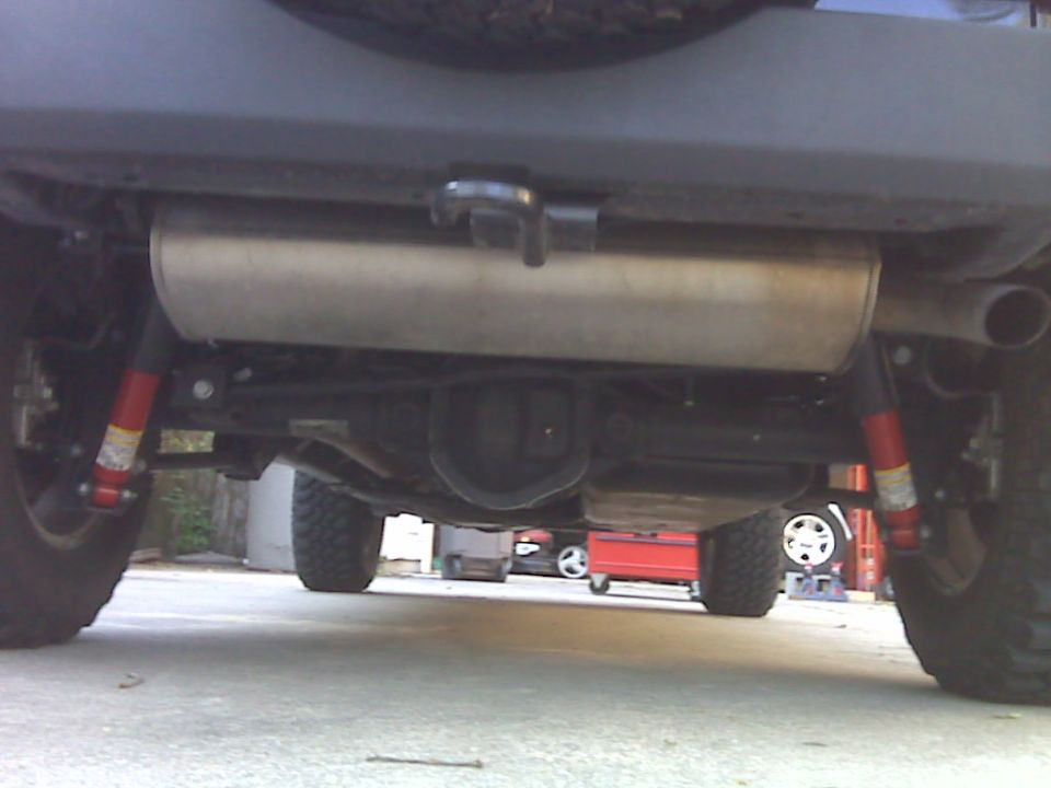 Underside of a Jeep Wrangler showing exhaust, differential, and suspension.