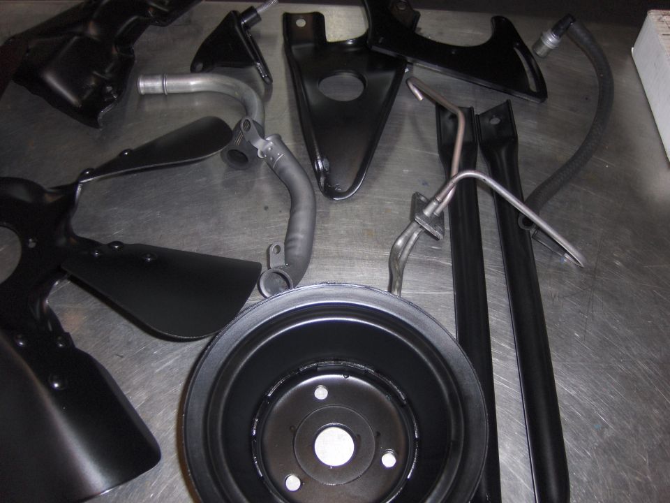 Spare tire and suspension parts visible