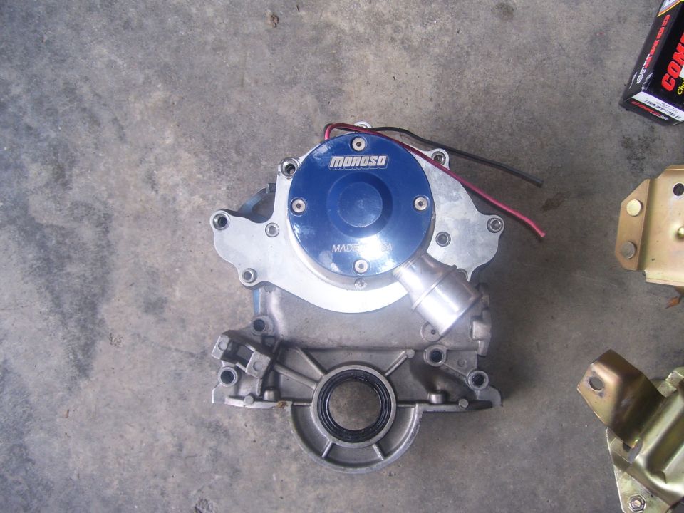 Moroso electric water pump with blue cover and silver outlet on concrete