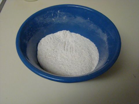 1989 Ford Bronco - A blue bowl filled with white powder sits on a light-colored surface.
