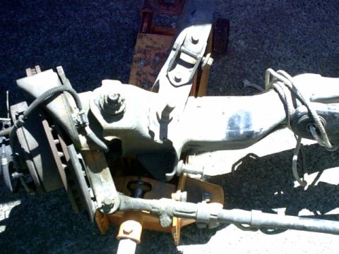 1995 Ford Bronco - Radius arm ready to come off. Notice where the bump stop was hitting