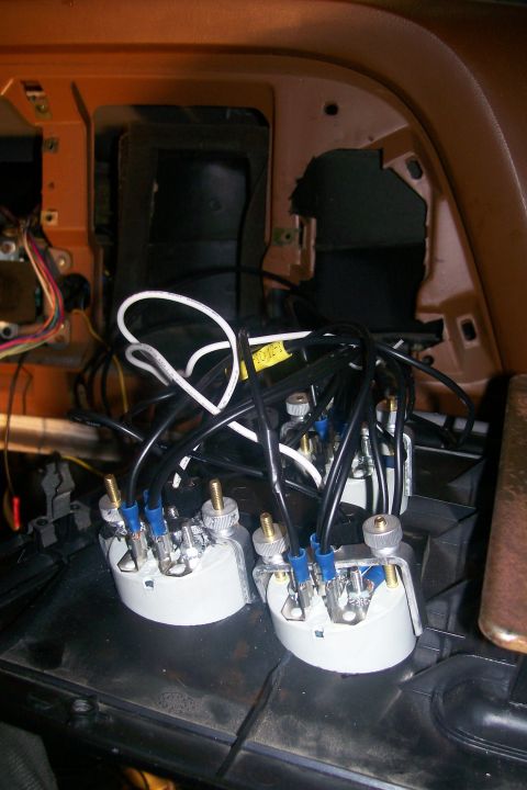 1982 Ford E350 - Close-up view of wiring and electrical connectors for two gauges mounted on a black dashboard surface. The gauges are white with silver mou…