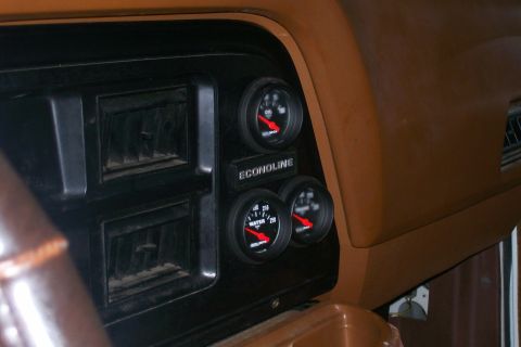 1982 Ford E350 - Close-up of a vehicle's dashboard showing air vents and aftermarket gauges.