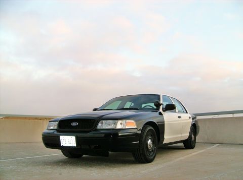 2004 Ford Crown Victoria - 2004 Ford Crown Victoria police car with a two-tone black and white paint scheme.