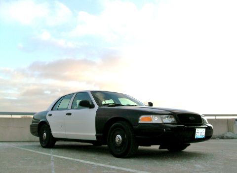 2004 Ford Crown Victoria - This 2004 Ford Crown Victoria has a two-tone paint scheme with the front half black and the rear half white.