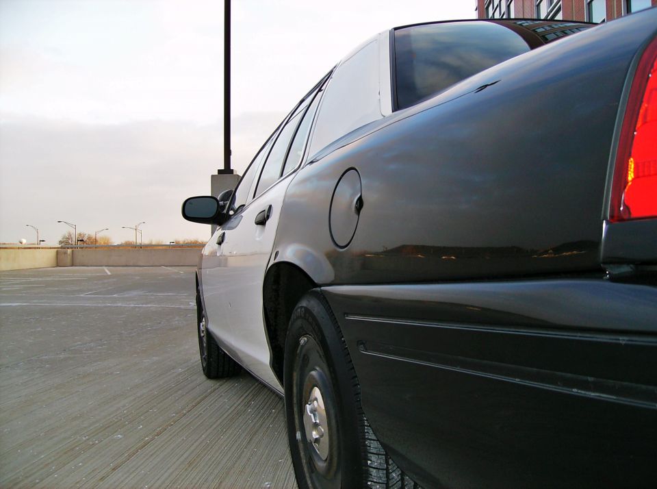 Two-tone police car side view, black rear and white front