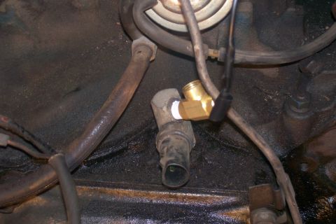 1982 Ford E350 - Engine block detail with a new sensor adapter installed in a threaded port.