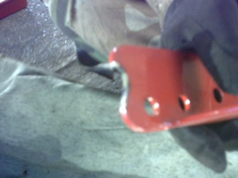 1995 Ford Bronco - First issue with the lift fabrication was that we had to notch the drivers side pivot arm drop bracket because a engine mount bracket rivet…