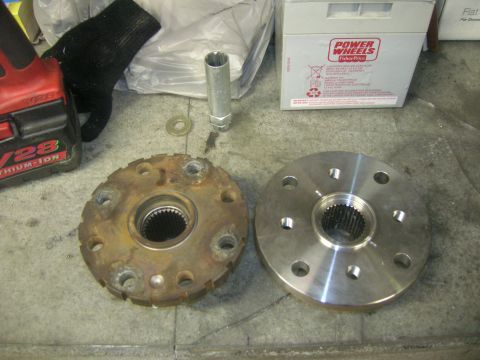 1996 Ford Bronco - Comparing a worn wheel hub to a new replacement part.