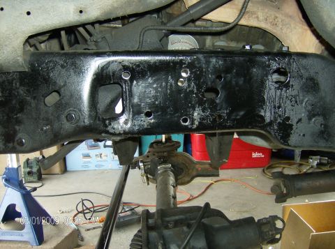 1990 Ford Bronco - Underneath view of a vehicle's frame and suspension system, showing parts and mechanical components.