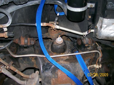 1995 Mercury Grand Marquis - Vehicle suspension components secured with blue straps, showing signs of rust. Date: 02/28/2009.