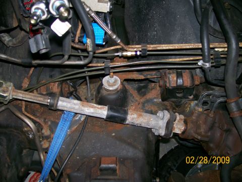 1995 Mercury Grand Marquis - This photo shows the underside of a vehicle, focusing on the steering and suspension system with visible rust.