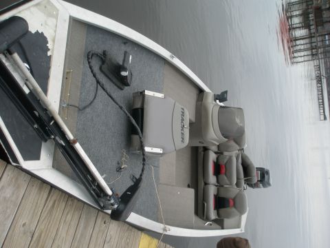 1998 Chevrolet Silverado 1500 - Interior view of a Tracker boat docked at a pier.