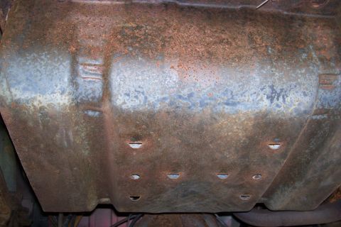 1995 Ford Bronco - Undercarriage component shows significant rust and wear, with no clear year identification.
