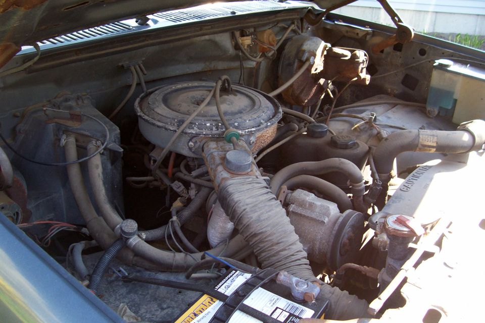 1986 Ford F-150 engine bay with air cleaner and radiator hoses